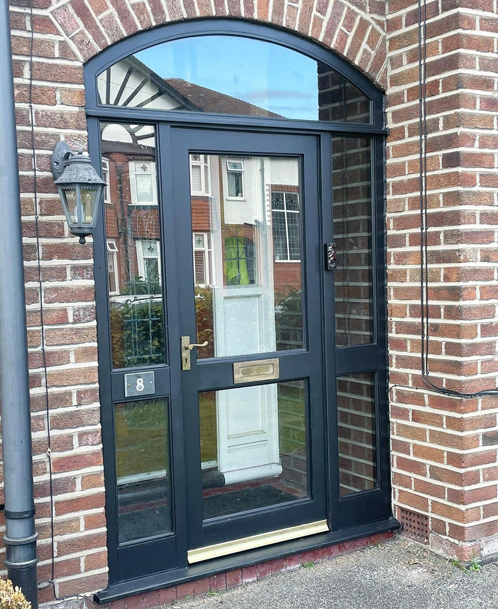 Front door with windows sprayed black