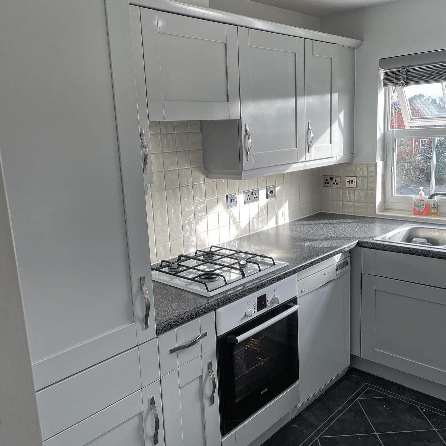 Kitchen makeover after cupboards being sprayed white