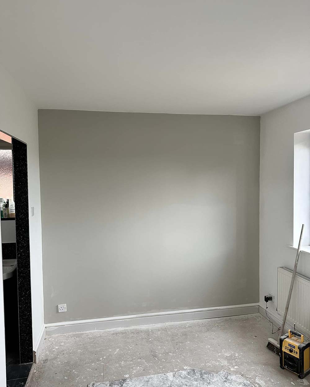 Interior wall after being sprayed grey