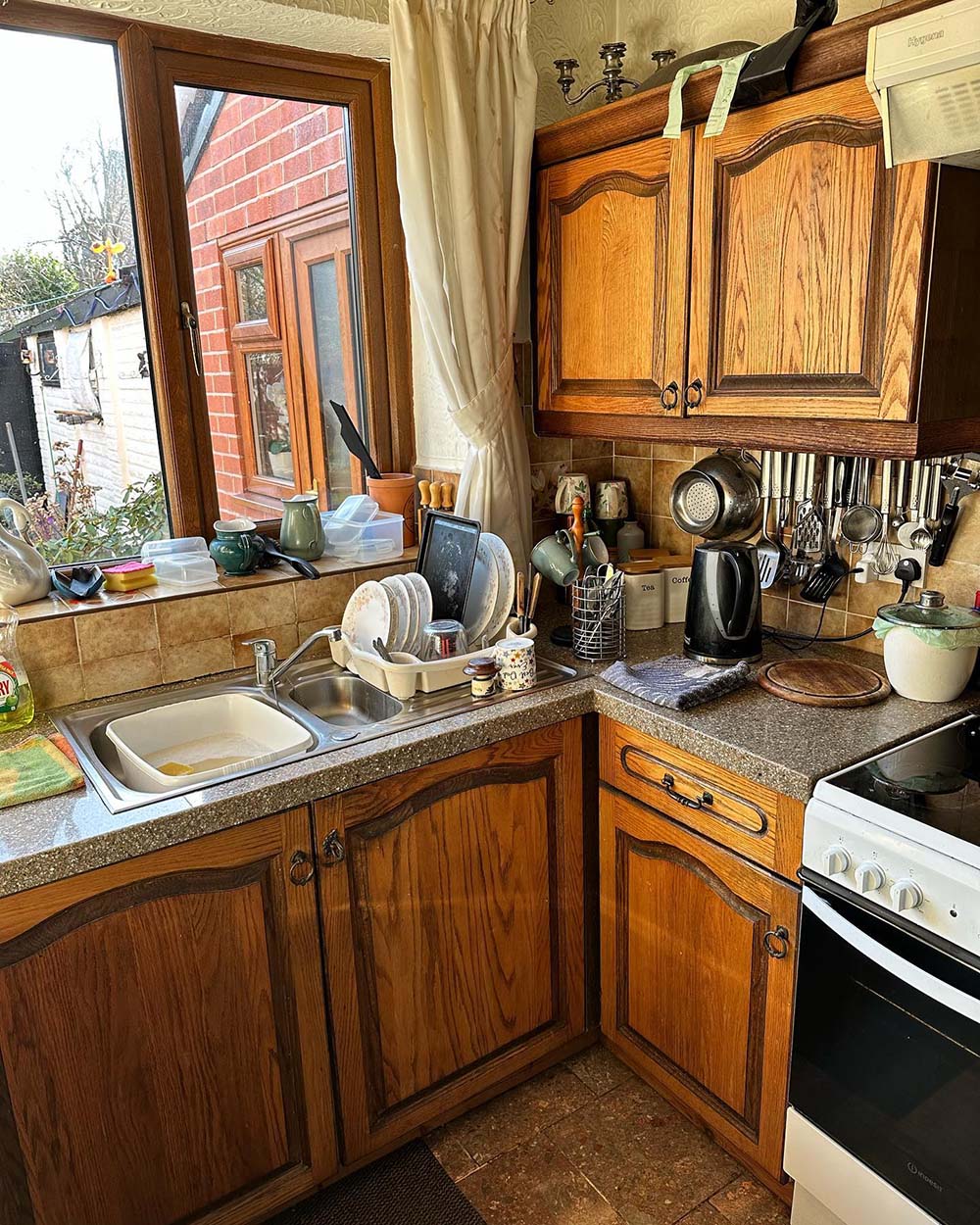 old style kitchen with stained wooden cupboards