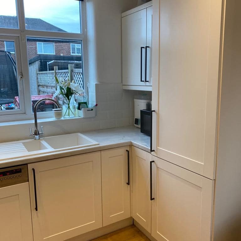 Small Kitchen sprayed white with new black handles